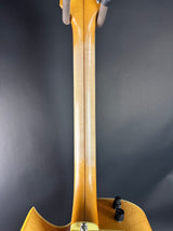 Close-up of a wooden cello on a dark background