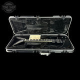 Electric guitar in a hard-shell case with 'Tone Shop' logo.