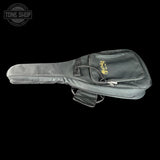 A dark gray guitar or bass gig bag with a gold 'Tone Shop' logo on the front pocket, shown against a solid black background.