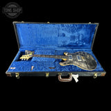 Guitar in a blue case with 'Tone Shop' logo in the corner
