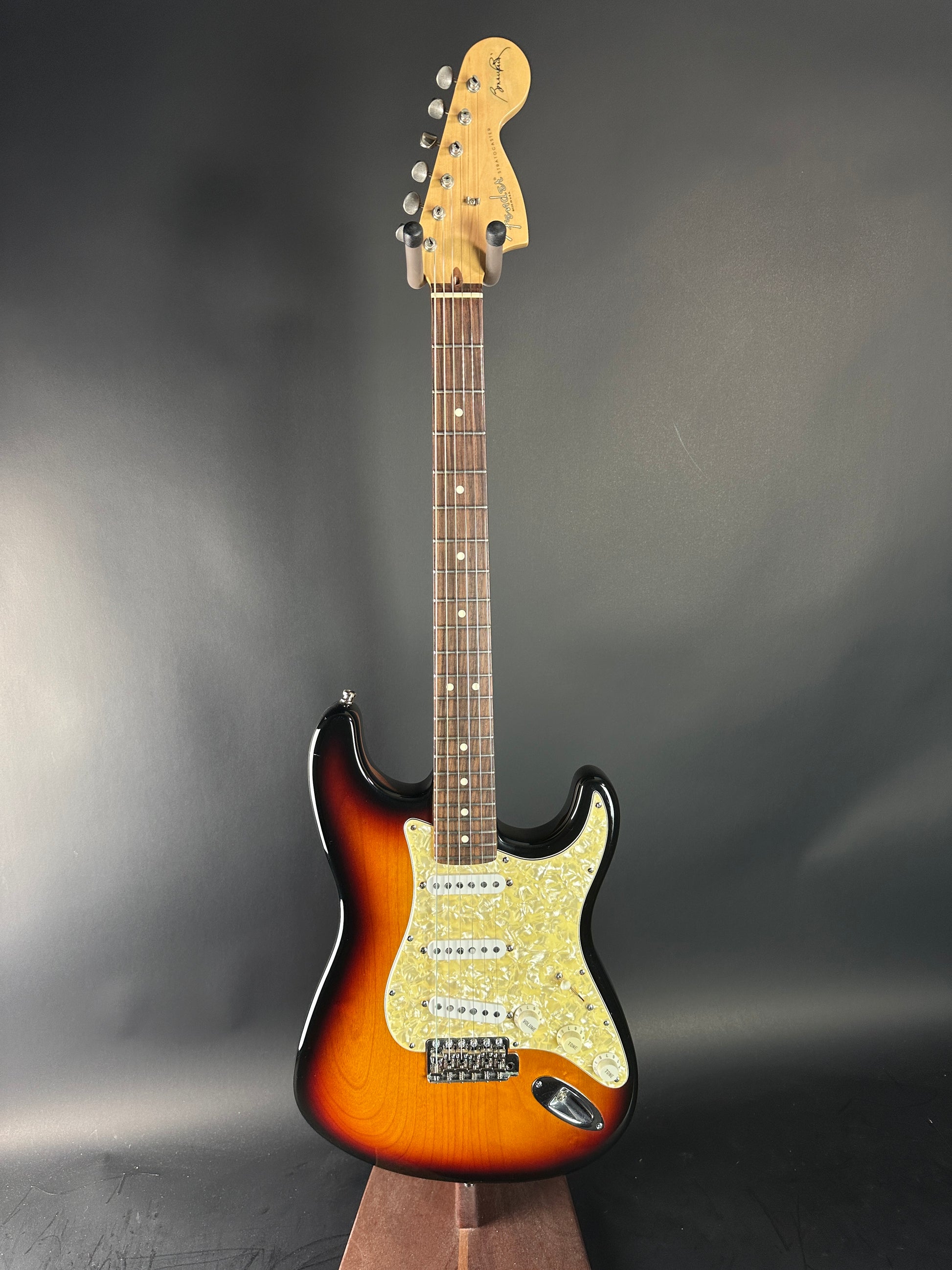 Electric guitar with a sunburst finish on a gray background