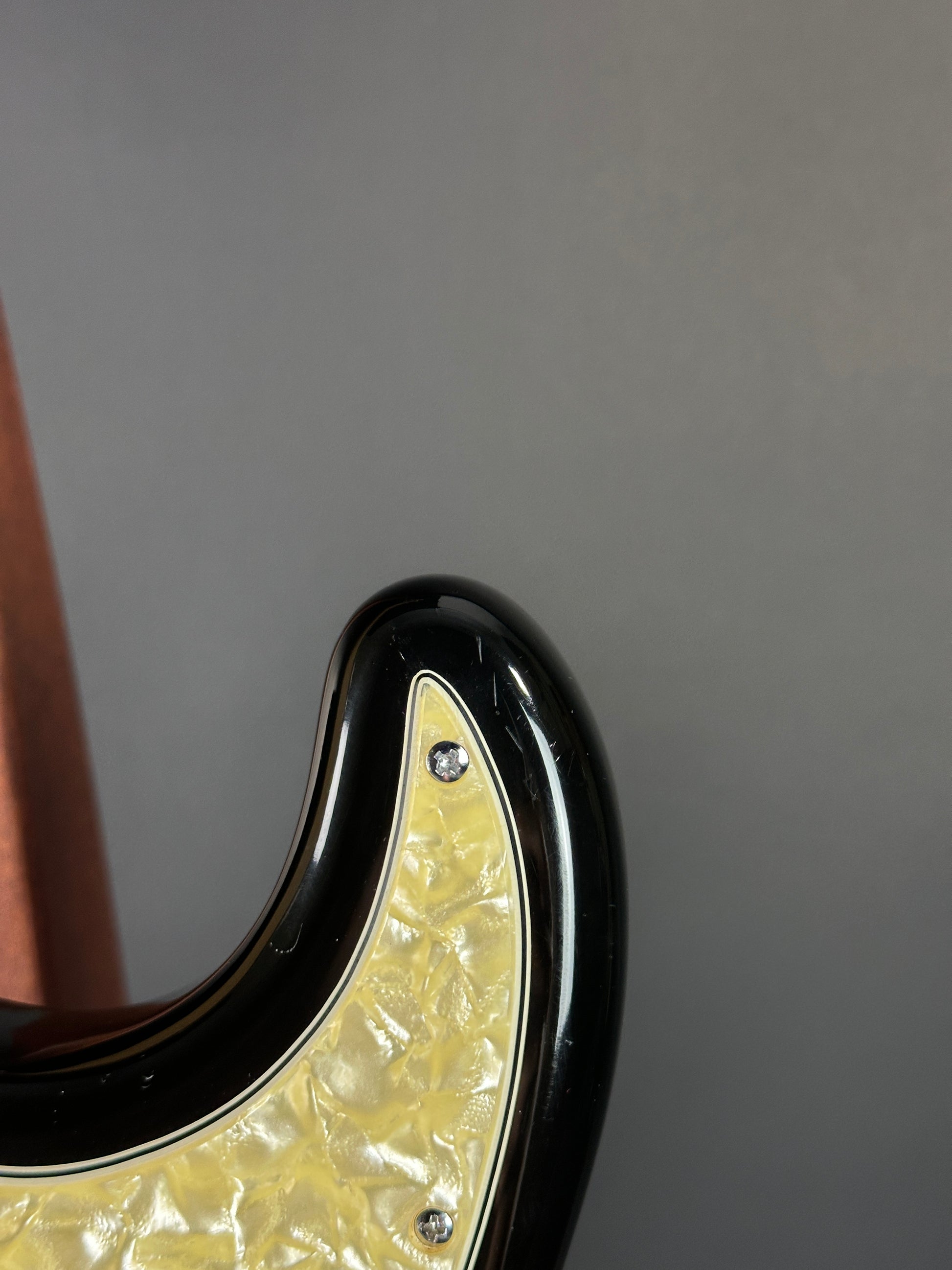 Wear on upper horn of Used Fender Bonnie Raitt Stratocaster.