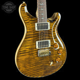 Wooden electric guitar with a visible brand logo on a black background