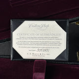 Certificate of authenticity for a C.F. Martin guitar on a dark background