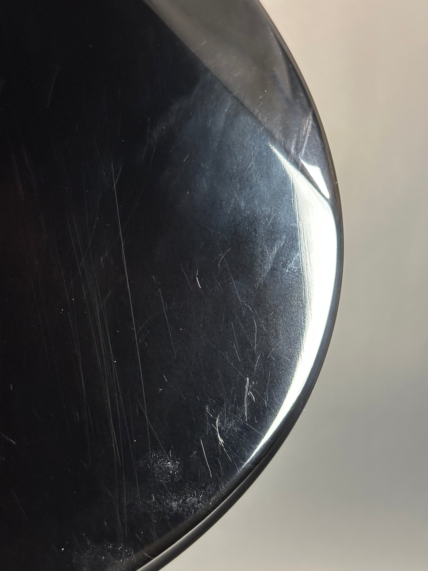 Scratched black surface with a light gray background