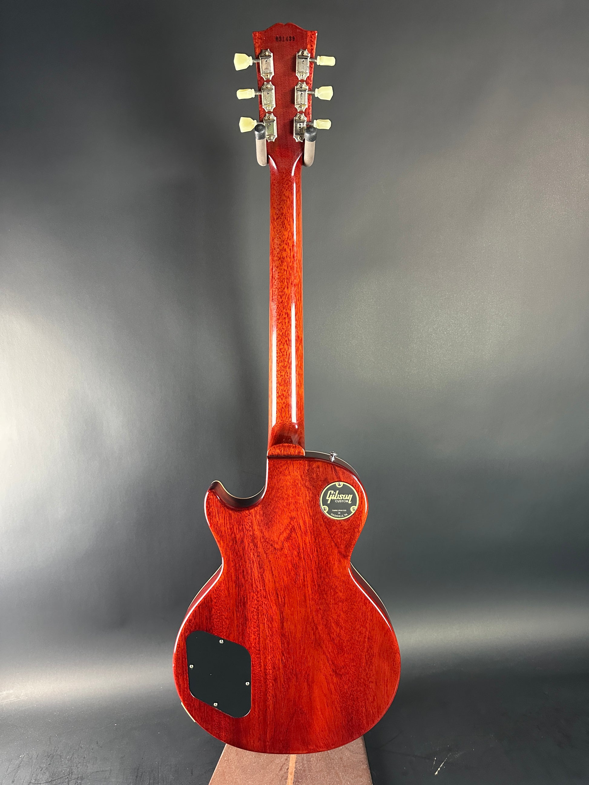 Red electric guitar on a gray background