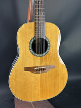 Acoustic guitar on a dark background