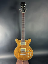 Wooden electric guitar on a dark gray background