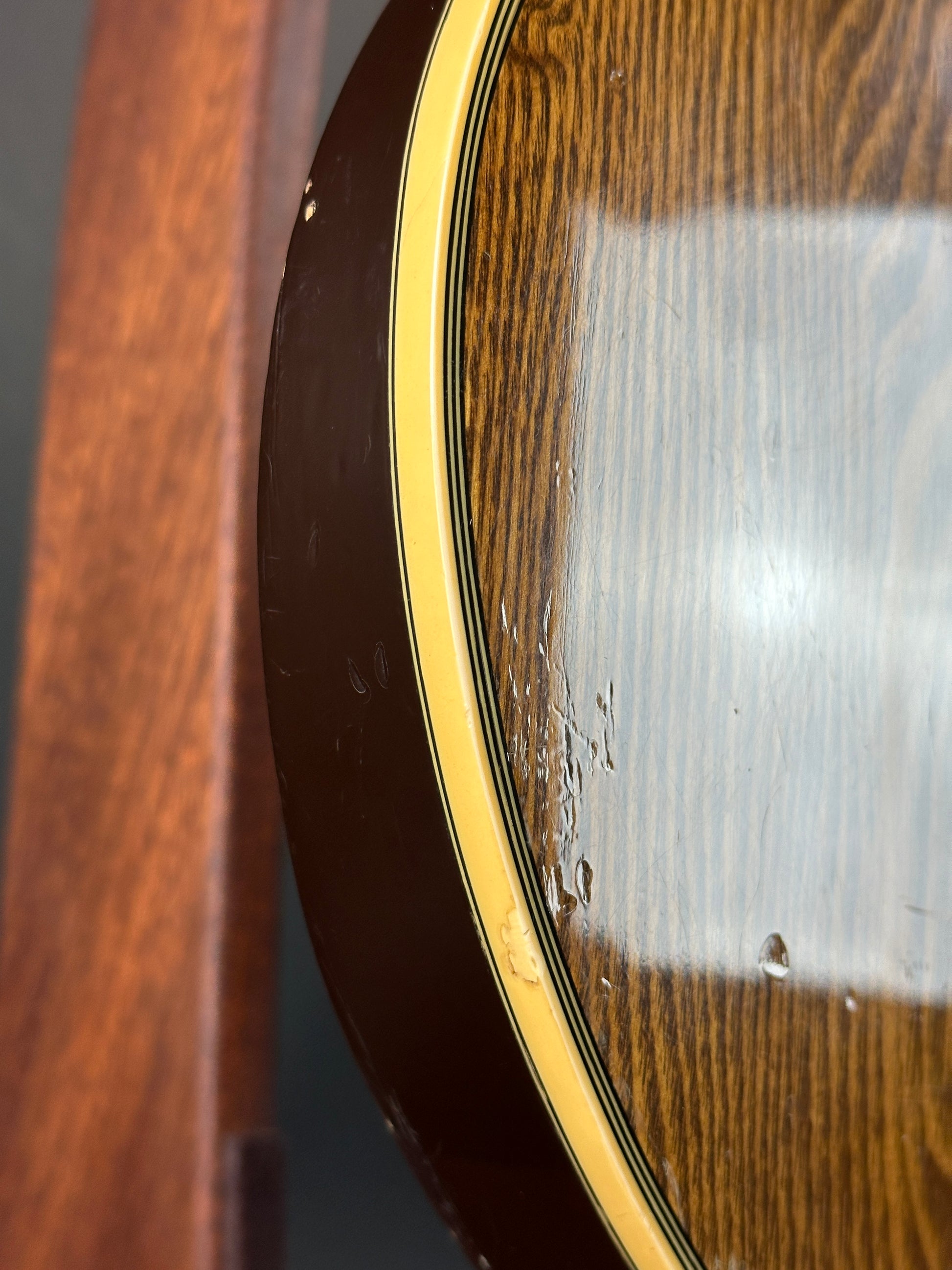 Close-up of a guitar's soundhole with wooden finish