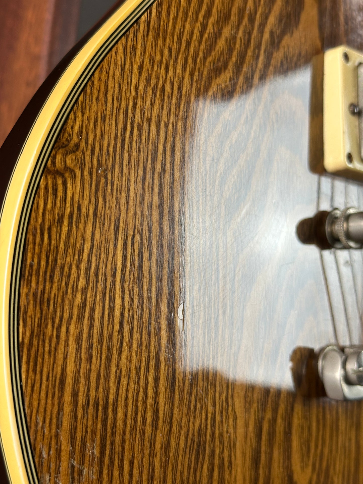 Close-up of a wooden surface with a visible scratch