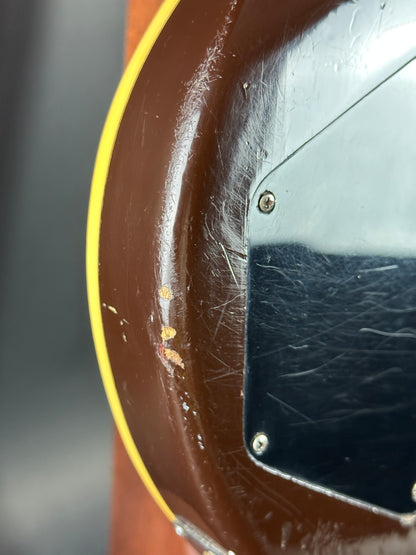 Close-up of a worn-out object with visible scratches and discoloration.