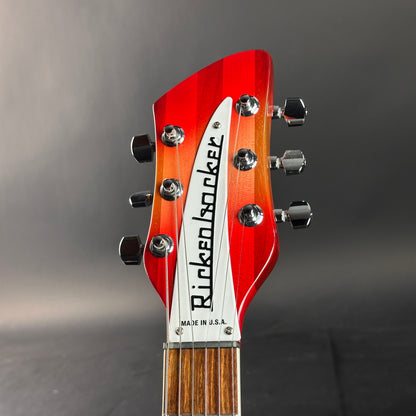 Guitar headstock with 'Rickem' branding on a gray background