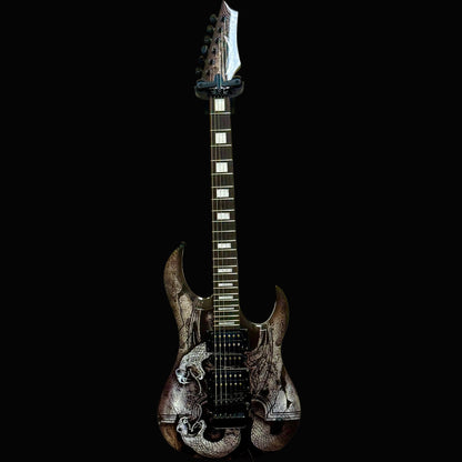 Electric guitar with a black and white design on a beige wall