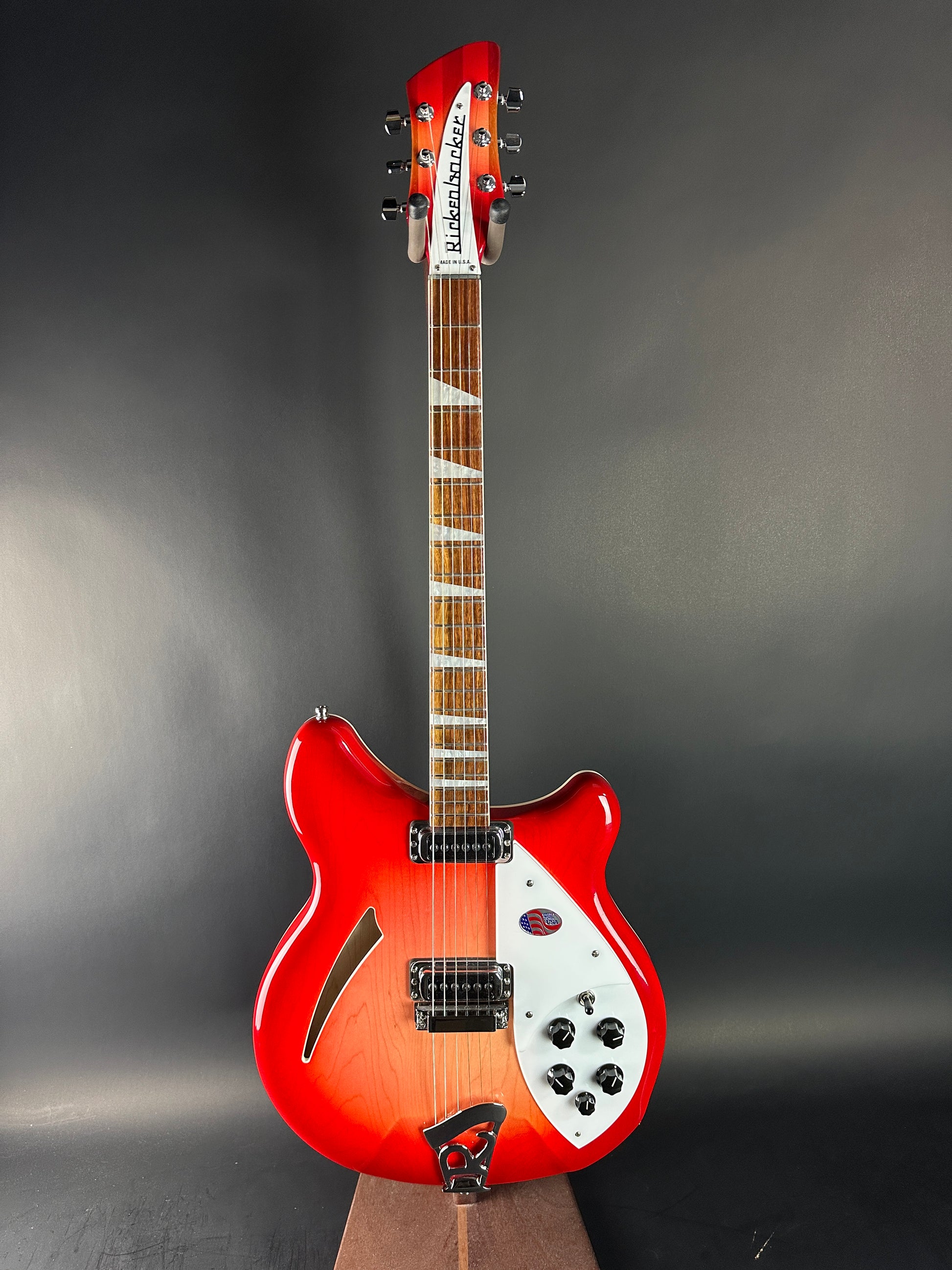 Red electric guitar on a dark gray background