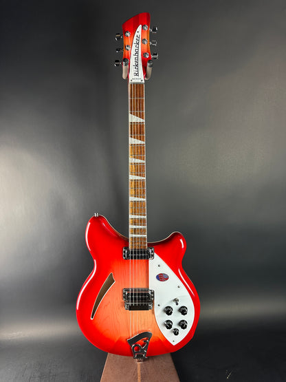 Red electric guitar on a dark gray background