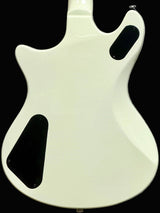 White guitar body with black pickguard on a gray background