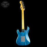 Blue electric guitar with gold hardware on a black background, featuring 'Tone Shop' logo.