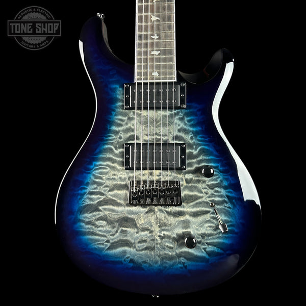 Electric guitar with a blue and black wavy pattern on a black background, featuring the Tone Shop logo.