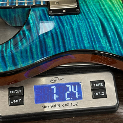 Guitar on a digital scale displaying weight