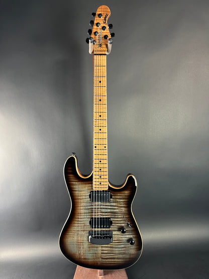 Electric guitar with a sunburst finish on a gray background