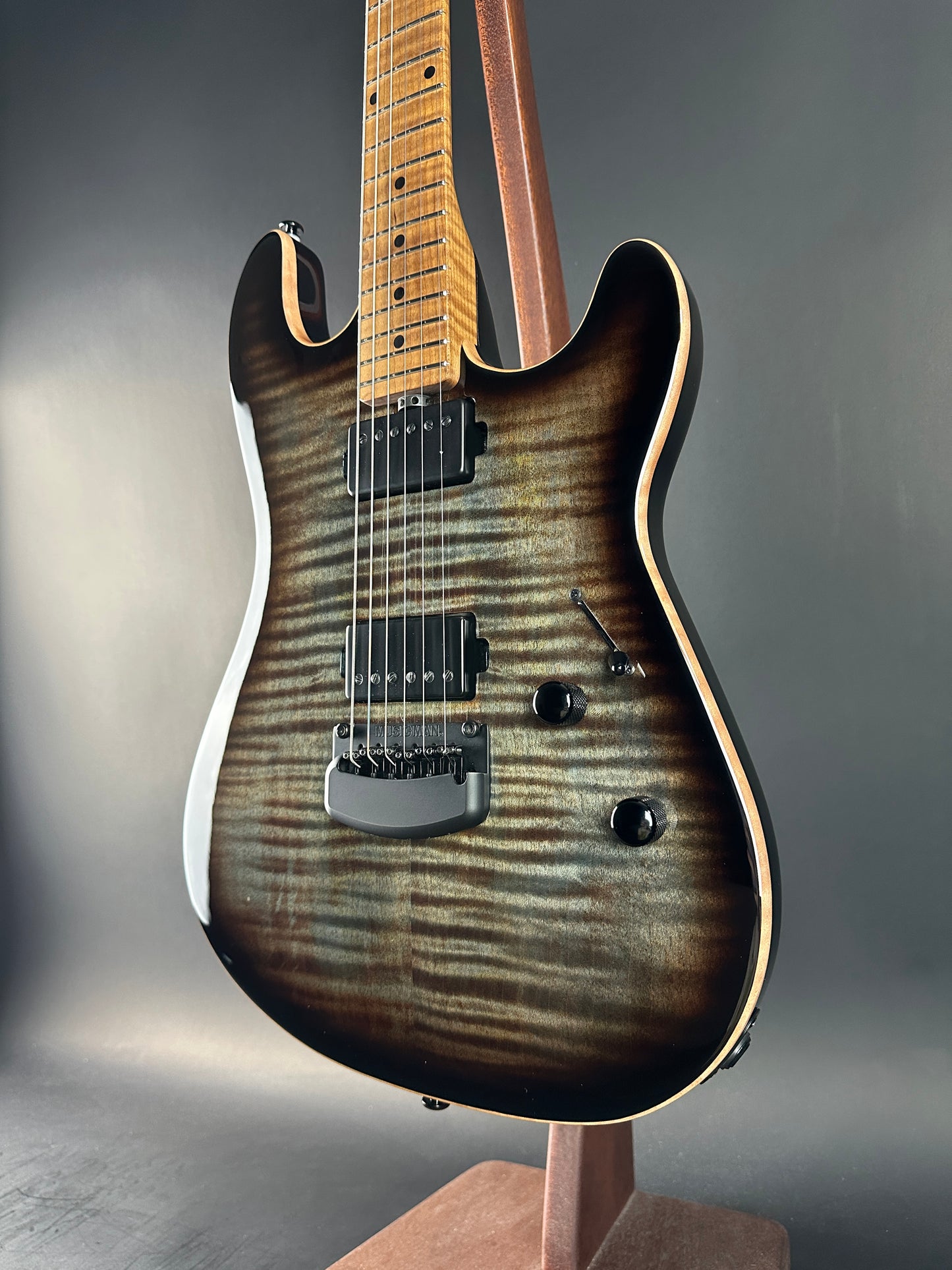 Electric guitar with a sunburst finish on a gray background