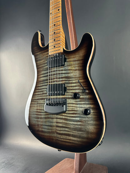 Electric guitar with a sunburst finish on a gray background