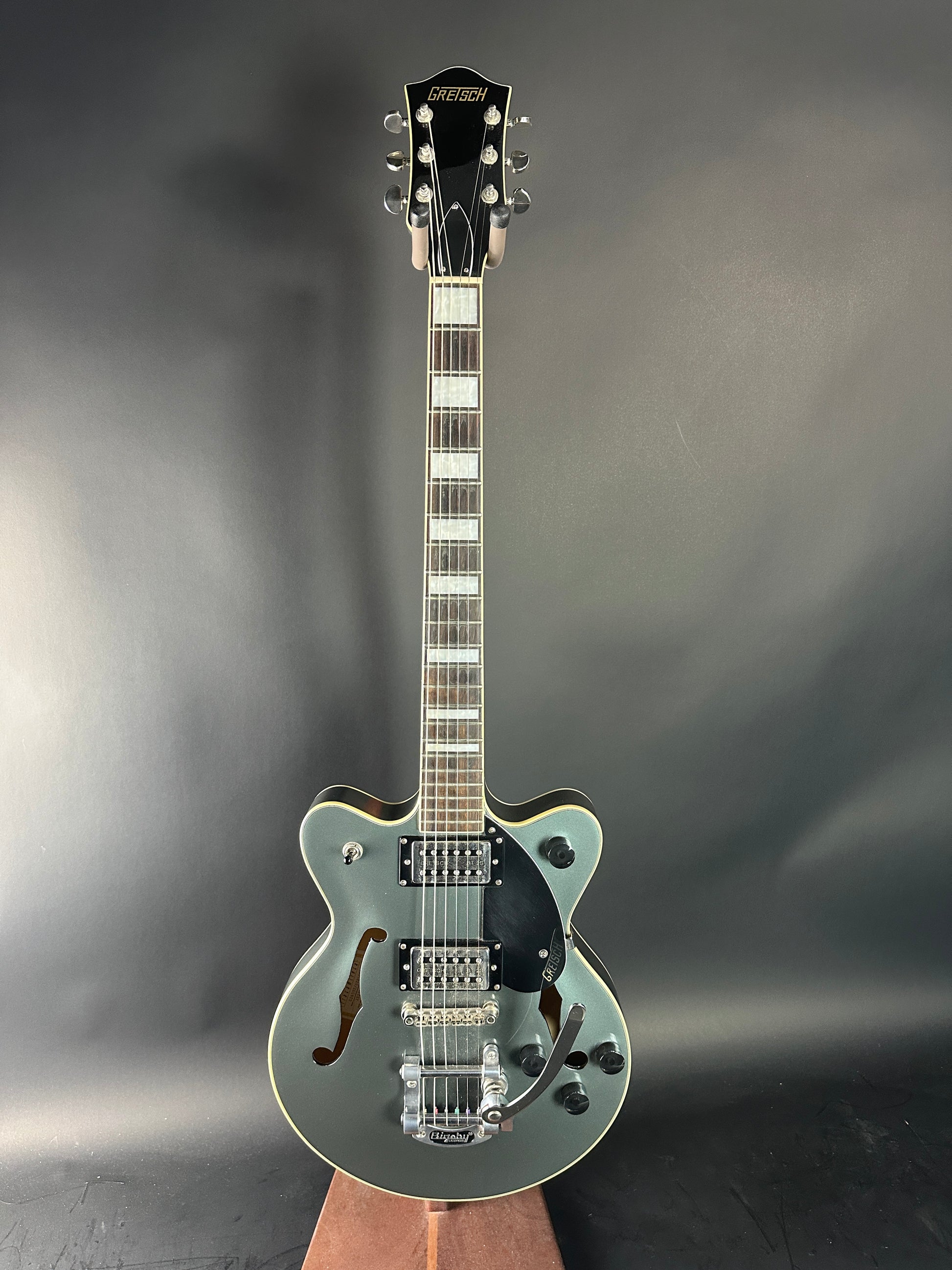 Electric guitar with a metallic finish on a gray background