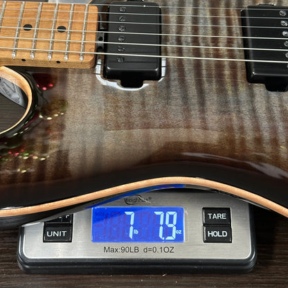 Guitar on a digital scale displaying weight