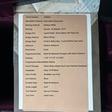 A product specification card detailing the materials and dimensions of a custom car headlight, photographed flat on a dark surface.