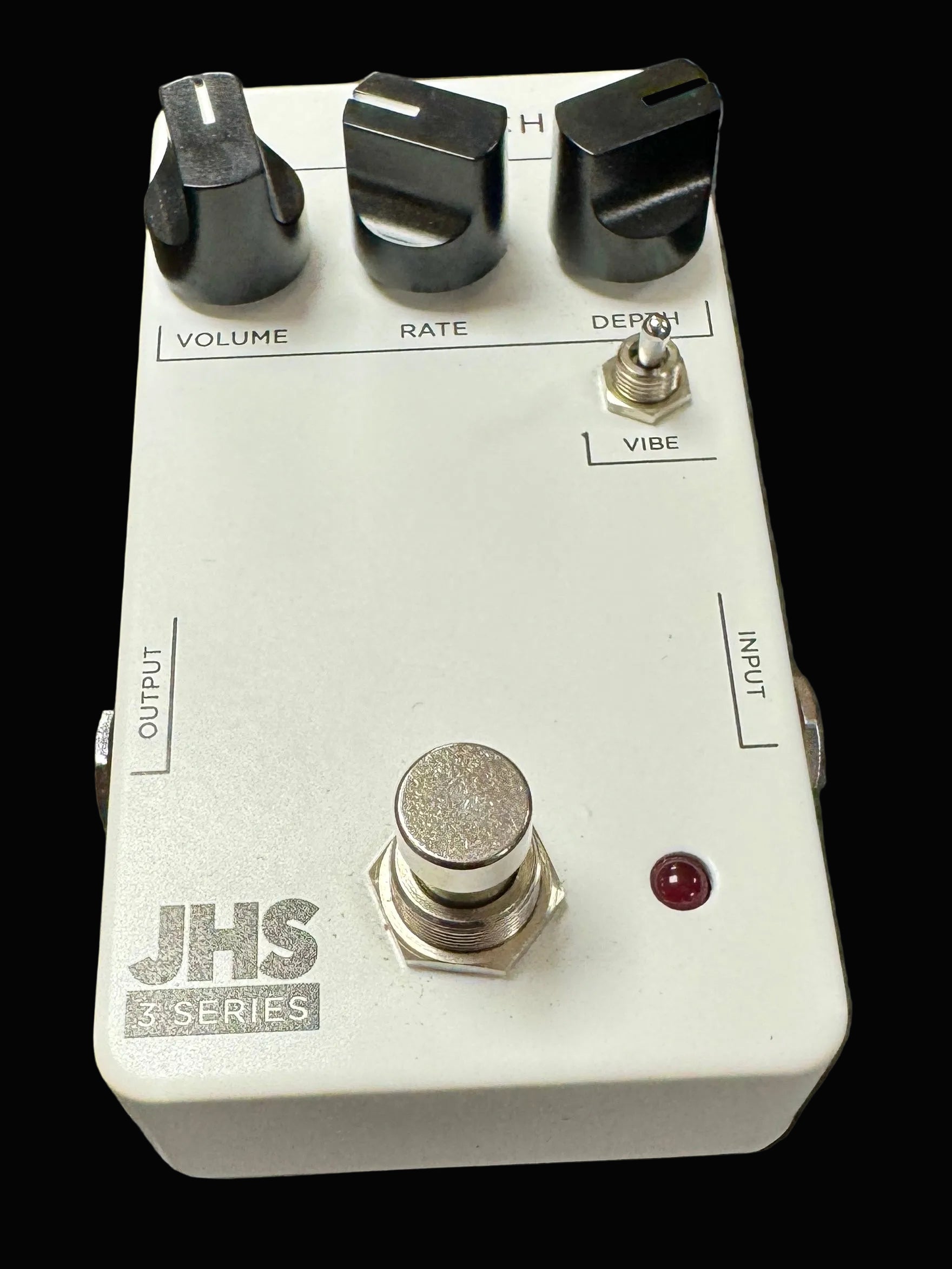 JHS Series guitar effects pedal on a textured surface