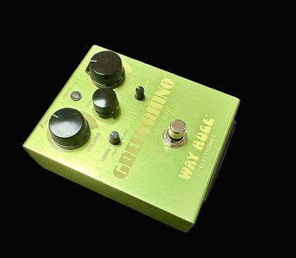 Green guitar effects pedal with 'Green Rhino' branding on a textured surface