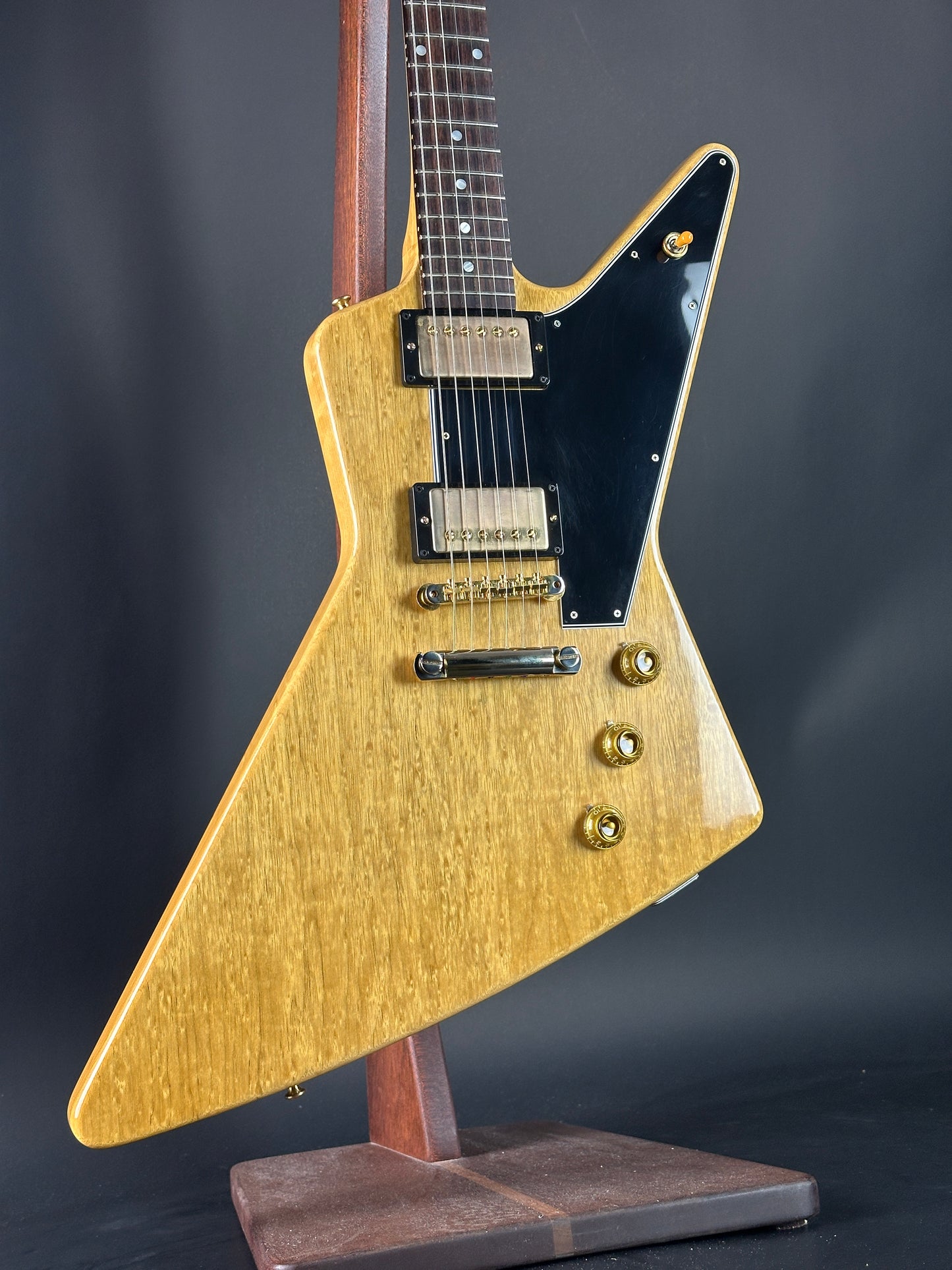 Front angle of Used 2022 Gibson Custom Shop 1958 Explorer Reissue Korina Black Pickguard.