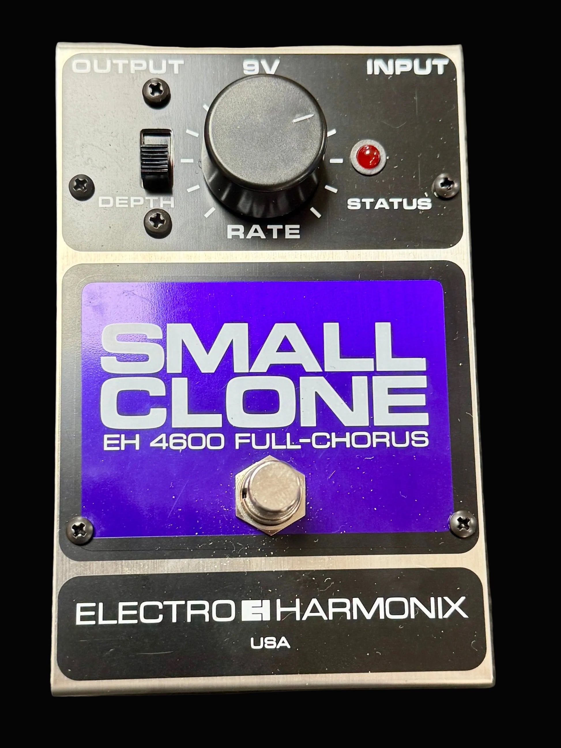 Electro-Harmonix Small Clone guitar effects pedal on a wooden surface