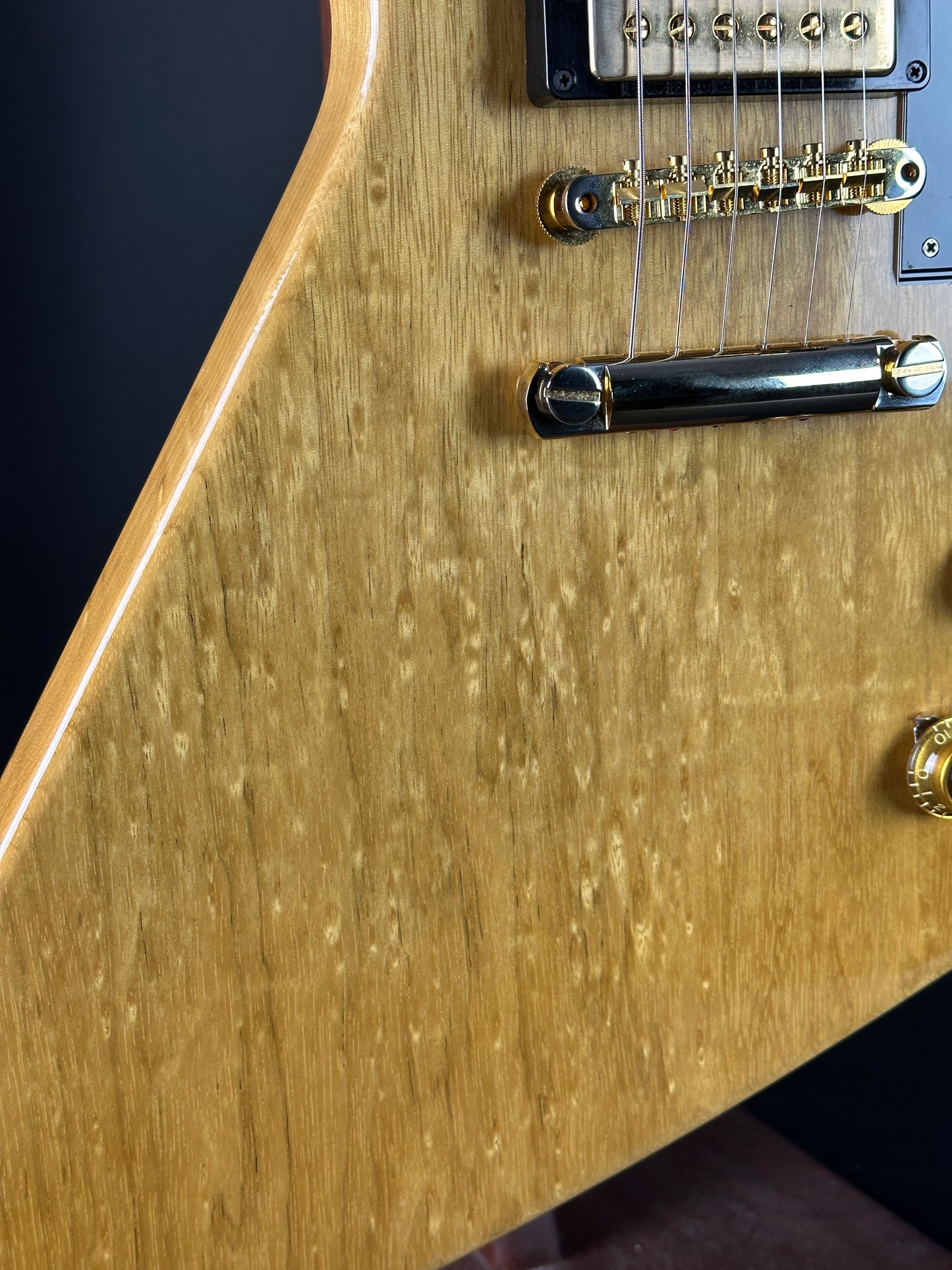 Front detail of Used 2022 Gibson Custom Shop 1958 Explorer Reissue Korina Black Pickguard.