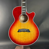 Acoustic guitar with a sunburst finish on a dark background
