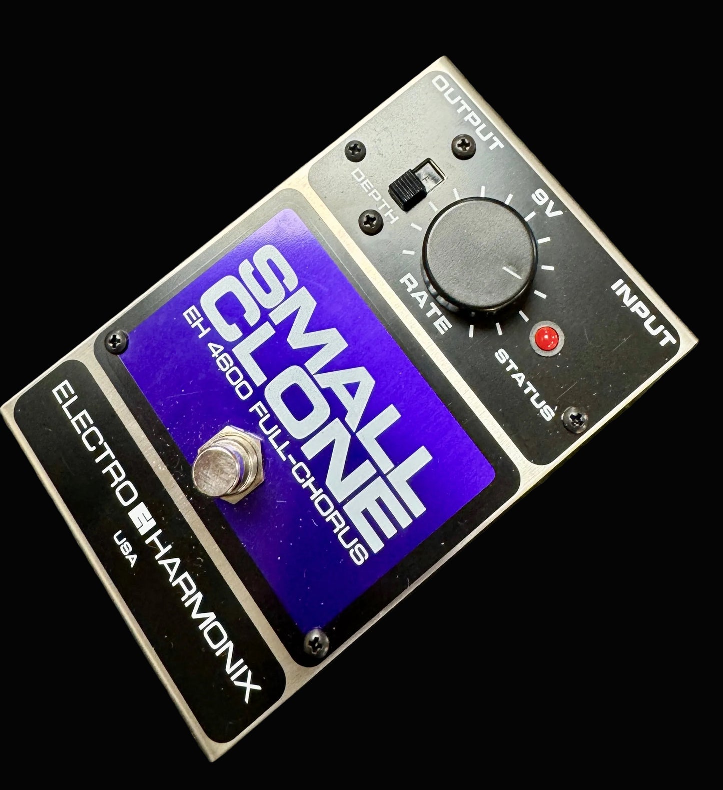 Electro-Harmonix Small Clone guitar effects pedal on a textured surface