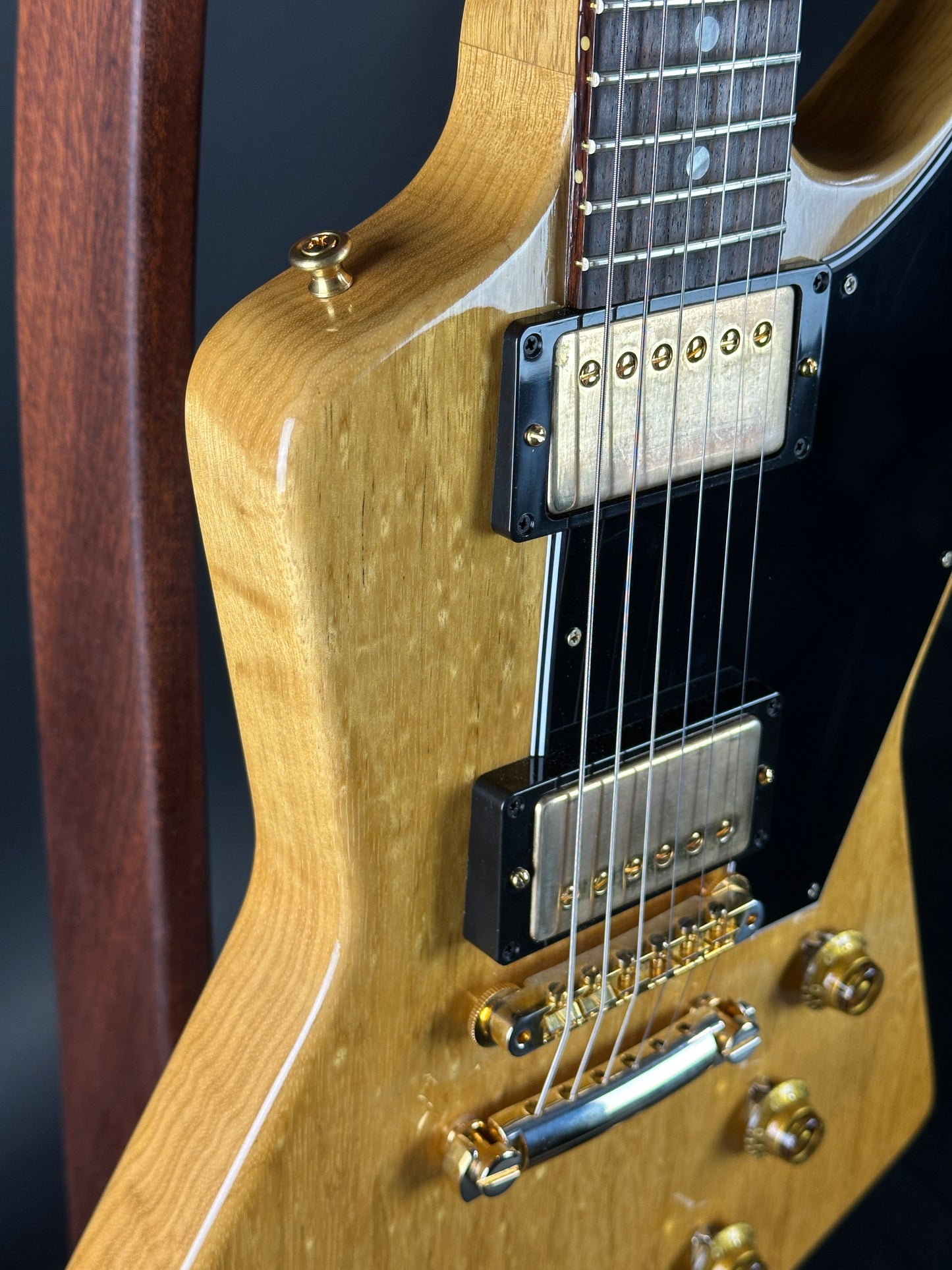 Front angle of Used 2022 Gibson Custom Shop 1958 Explorer Reissue Korina Black Pickguard.