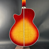 Glossy finish on a guitar body against a dark background