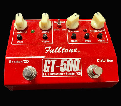 Red Fulltone GT-500 guitar effects pedal on a wooden surface