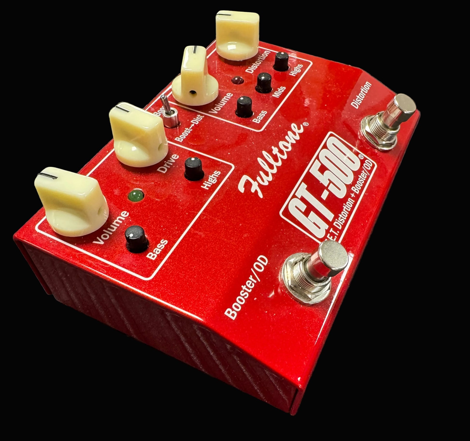 Red Fulltone GT-500 guitar effects pedal on a textured surface