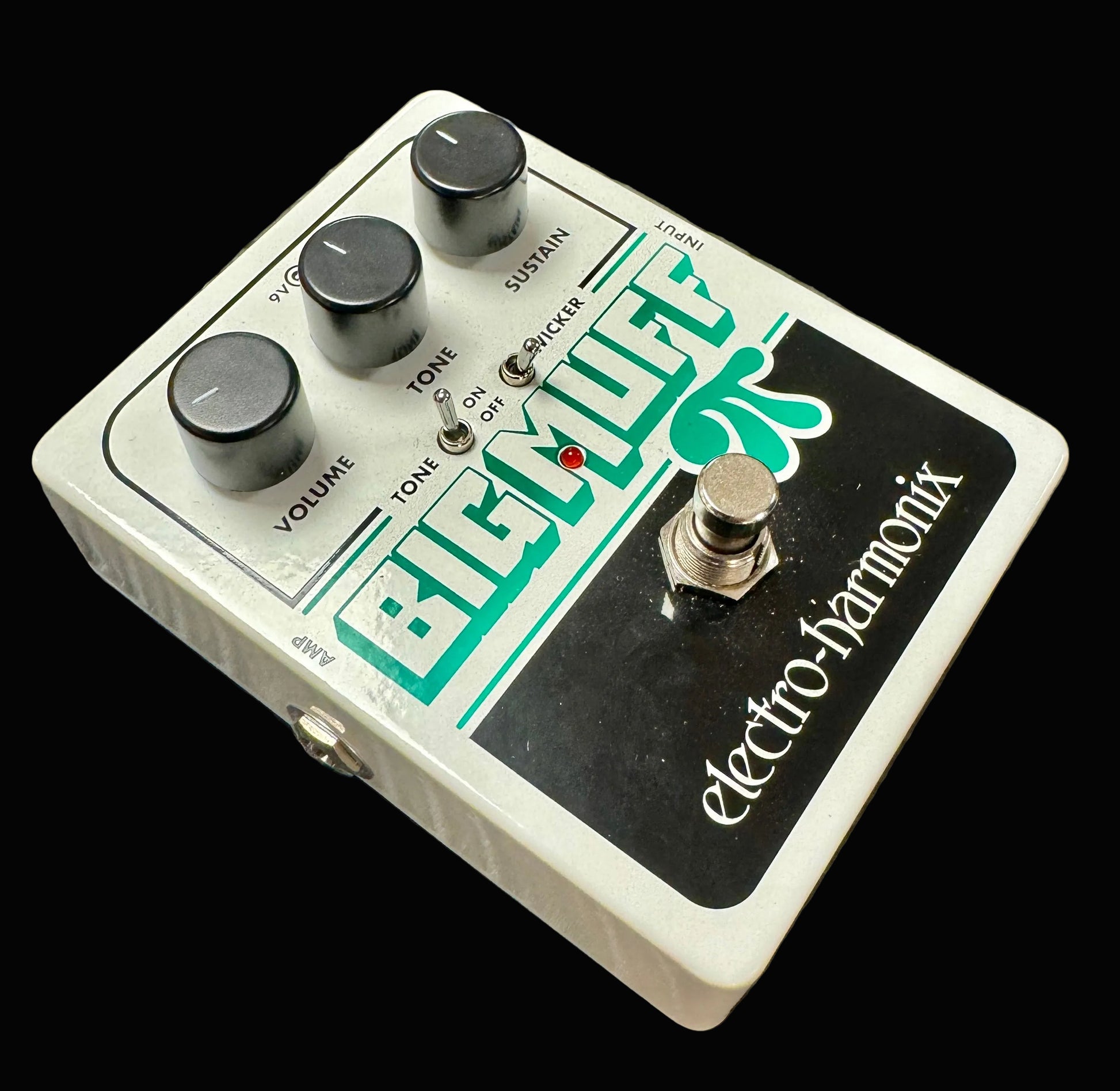 Electro-Harmonix Big Muff Pi guitar effects pedal on a textured surface