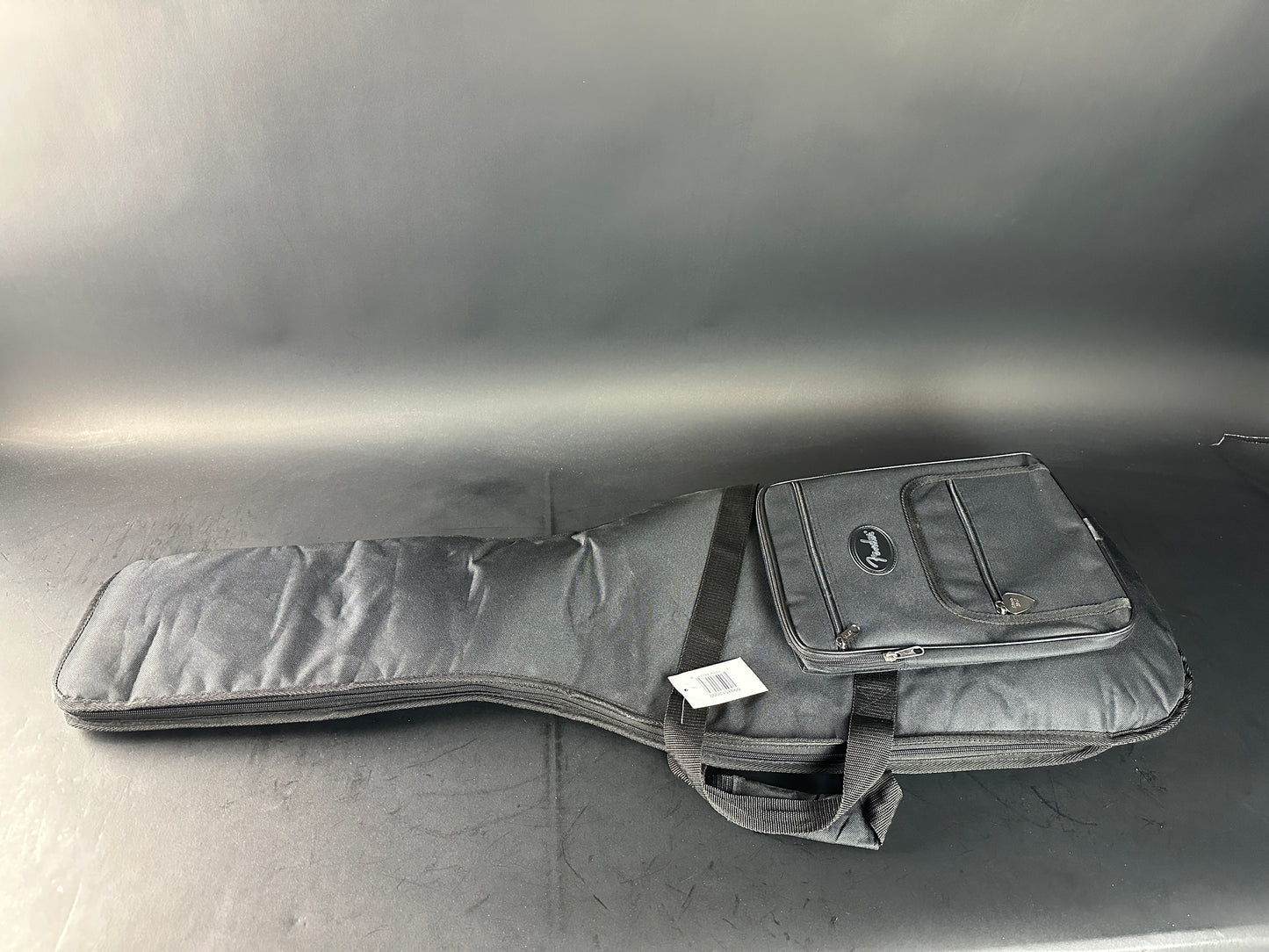 Gray guitar case on a reflective surface