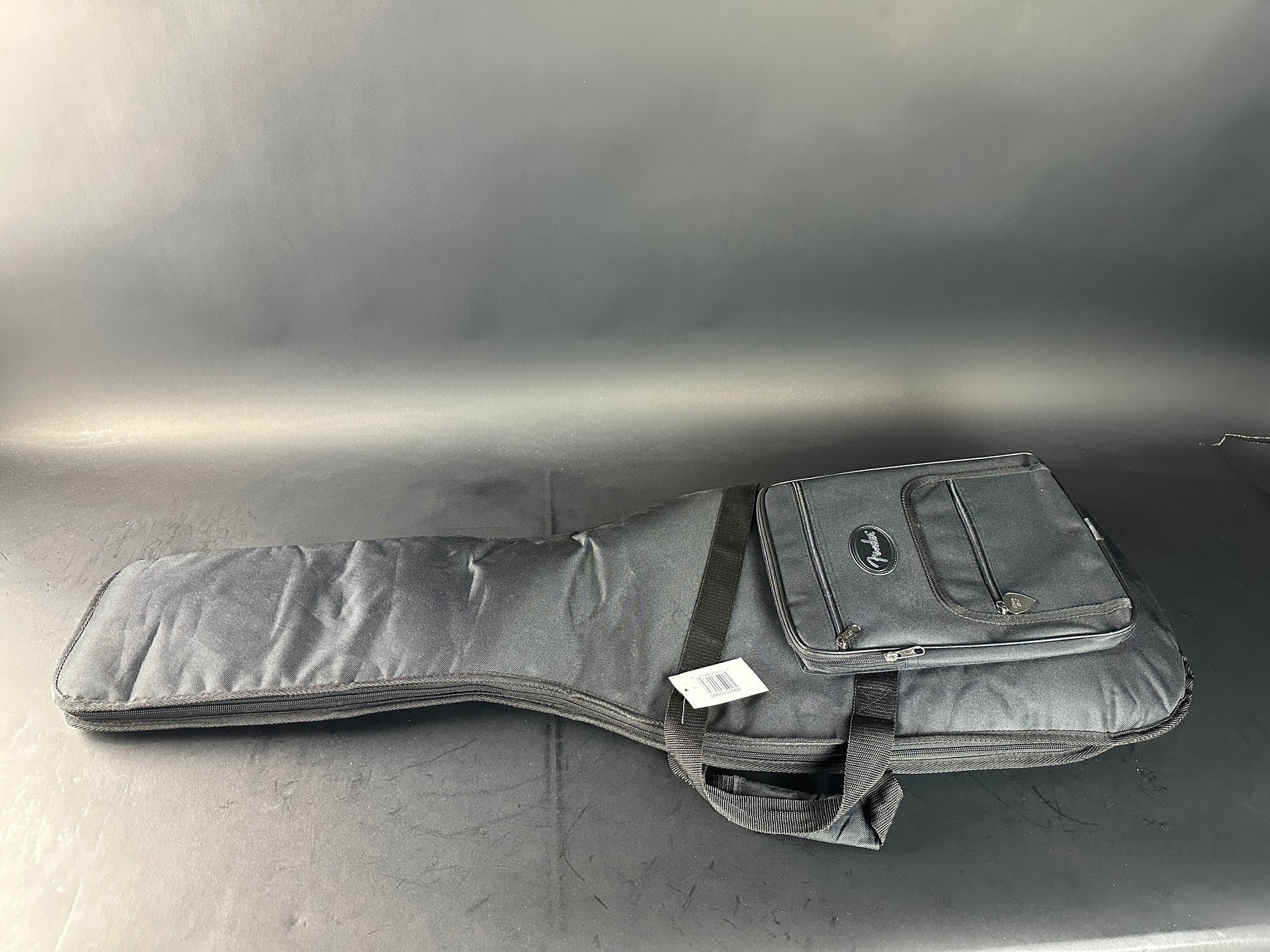 Gray guitar case on a reflective surface