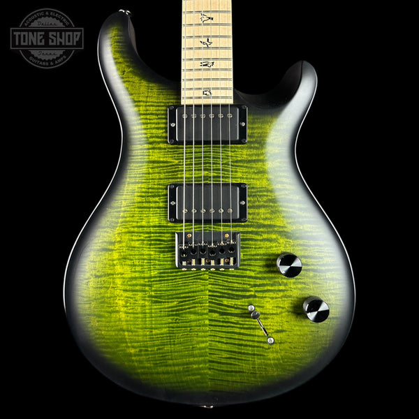 Green electric guitar with a black background