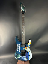 Blue electric guitar with floral design on a gray background