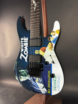 Guitar with a 'Zombie White' design on a dark surface