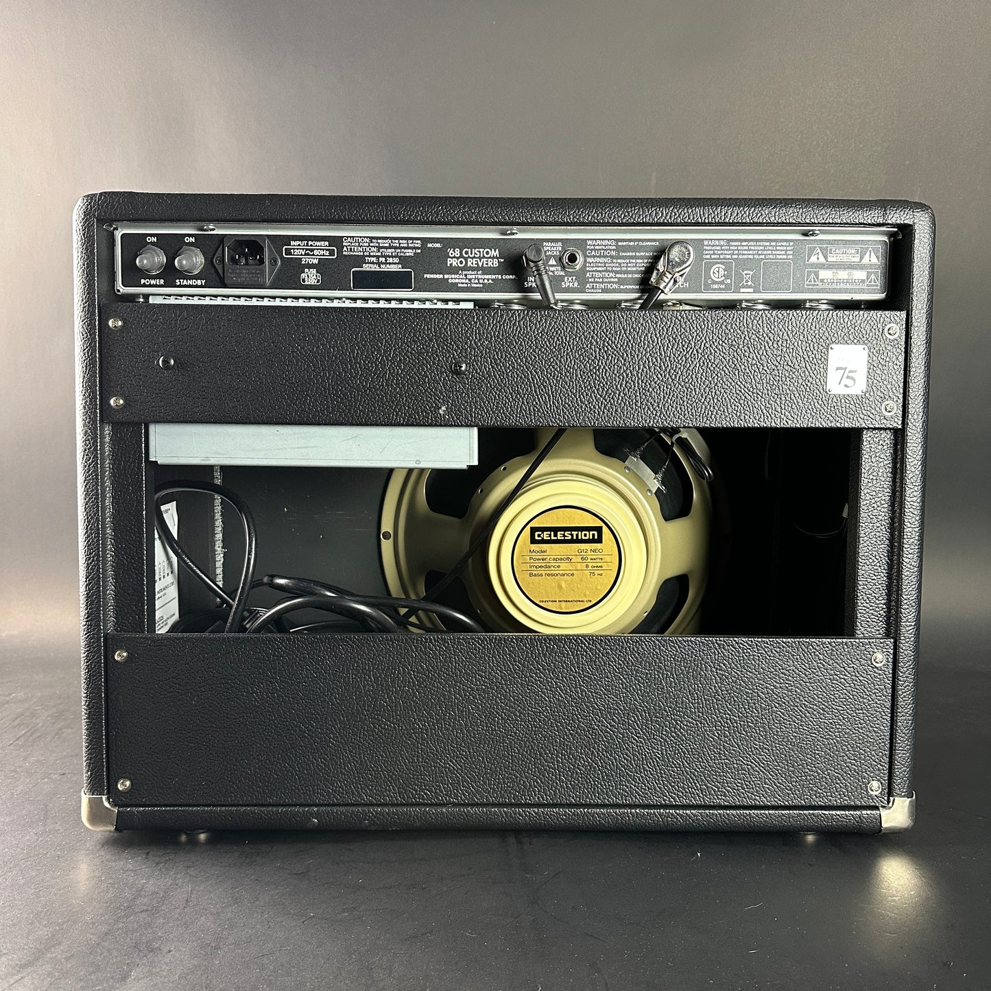Guitar amplifier with Celestion speaker on a gray background