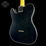 Rear view of a black Fender Telecaster electric guitar body with white binding and gold hardware, shown against a black background with a Tone Shop watermark in the top-left corner.