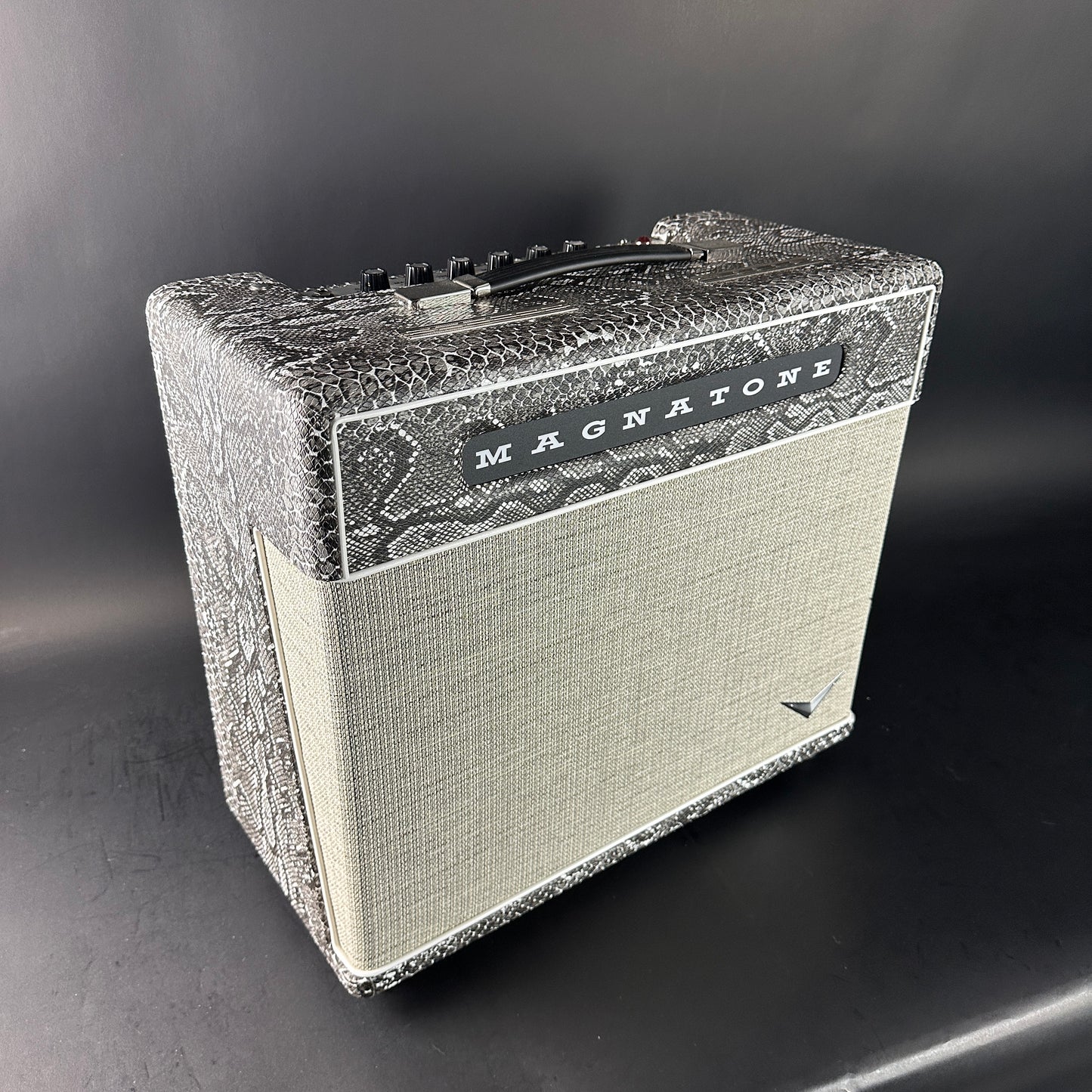 Vintage-style guitar amplifier with 'Magnatone' branding on a dark background