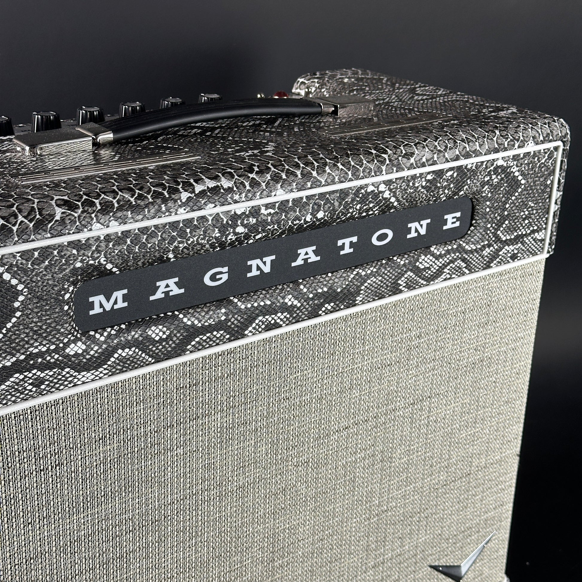 Close-up of a Magnatone guitar amplifier with a textured surface.